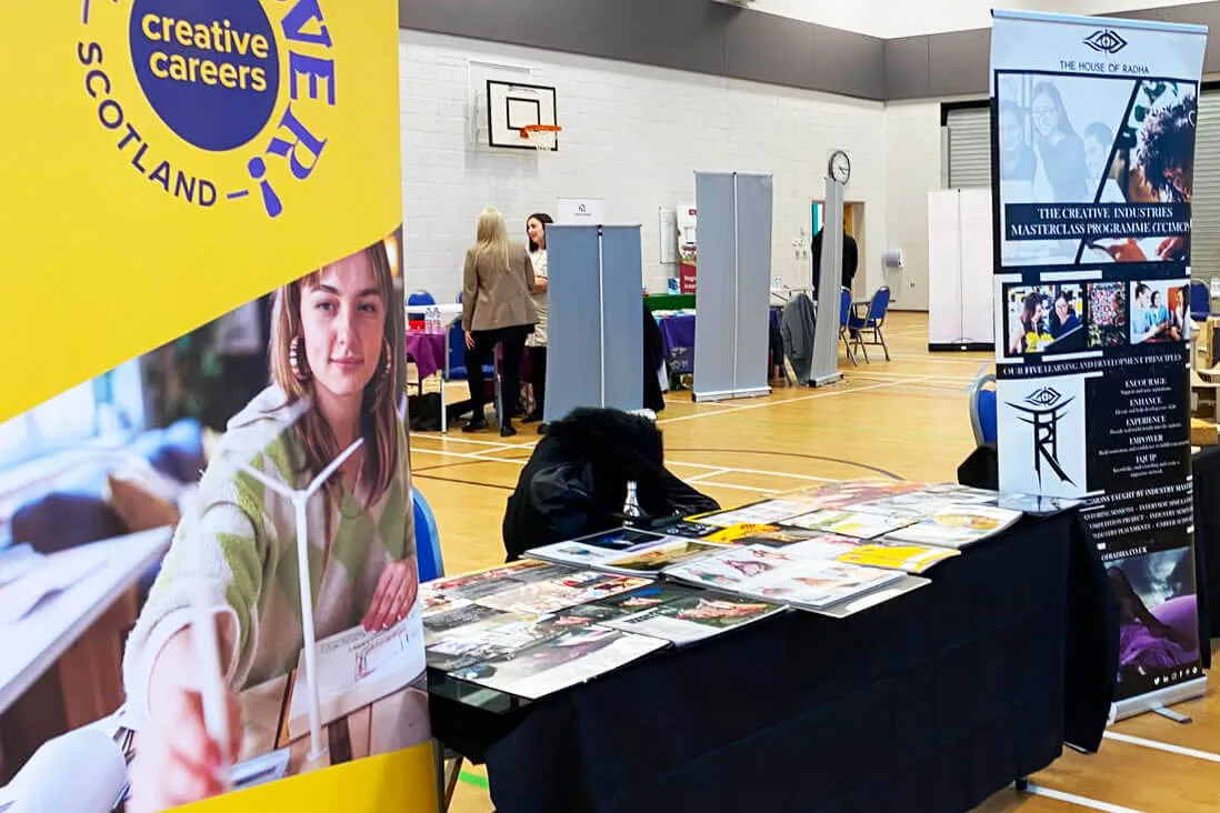 Discover Creative Careers Scotland exhibition stand at a career fair in a gym